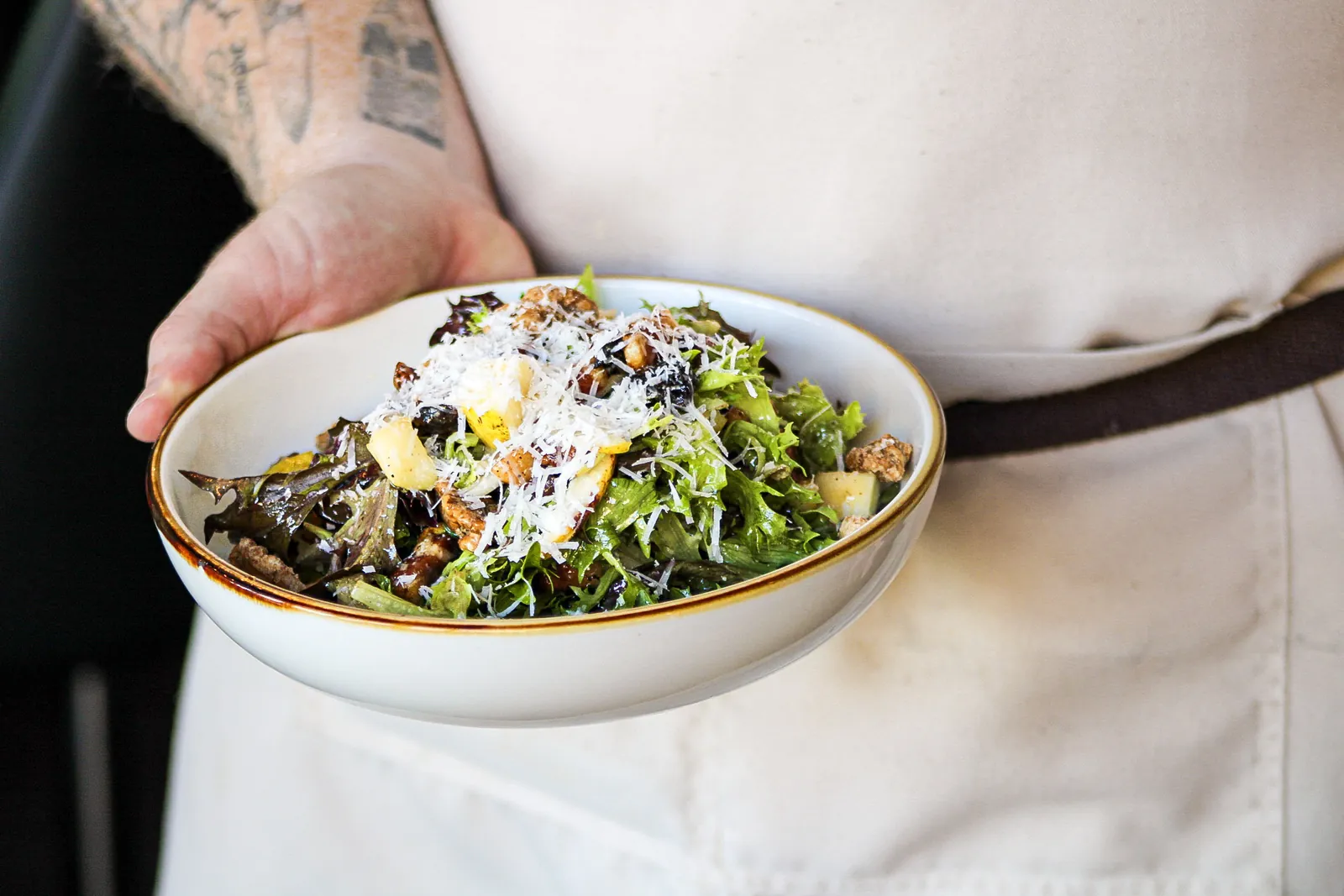 A salad being shared at the table