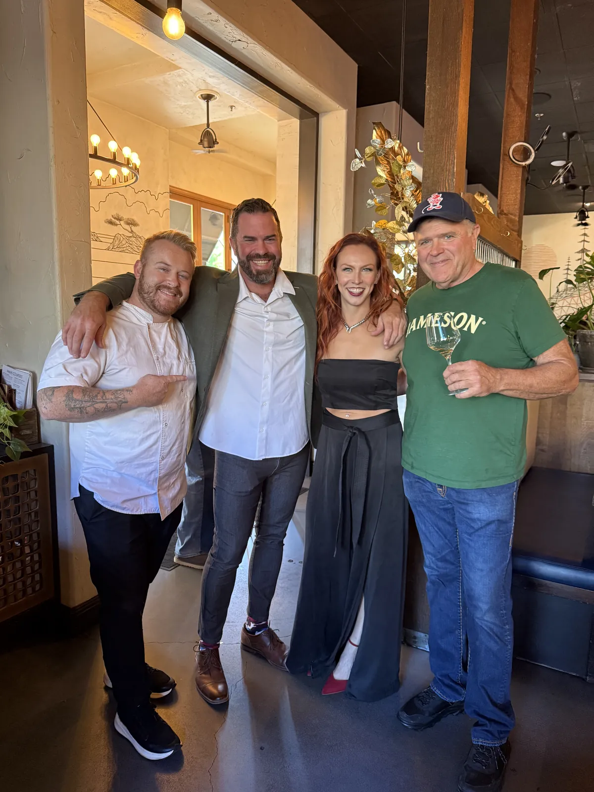 Chef Devin Dedier with family and guests in the Vacanza Romana dining room